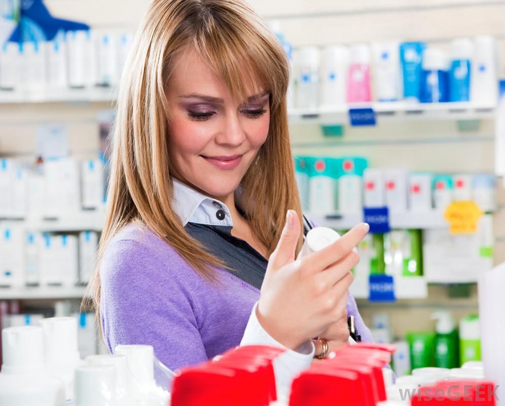 woman-smiling-at-drugs-in-pharmacy